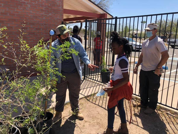 Luis provides a BYOB kit at a community workshop.