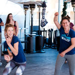WMG's Sarah Brown, Deborah Oslik and Lisa Shipek, mid-dance-move