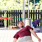 WMG's Sky Jacobs, Administrator and IT Manager, does the limbo