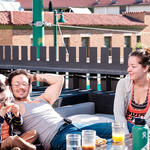 A family relaxes with breakfast treats. 