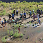 Tucsonans wade in the Santa Cruz River's new waters. Photo by Jamie Manser