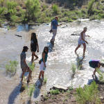 Tucsonans wade in the Santa Cruz River's new waters. Photo by Jamie Manser