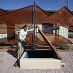 Karilyn Roach shows off the 10,000 gallon underground cistern. Photo: Mamta Popat