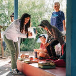 Cindy Hu demonstrating rainwater absorption to kids