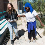 Riley Fletcher and her classmate Madina Omar, right, will use their temperature data to assess the changes in the low-water adapted garden.