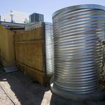 Gail Ryser, a Watershed Management Group co-op participant, helped install a water-harvesting system in someone else's home and got help in installations of two cisterns in her backyard.