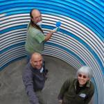 Volunteers paint cistern interior